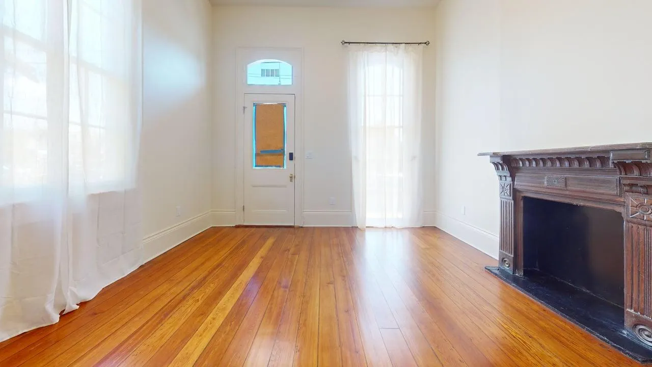 Living area after full rehabilitation — restored historic character, modern finishes